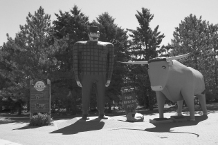 An 18-foot-tall statue of Paul Bunyan, the giant lumberjack, and his gigantic companion, Babe the Blue Ox, in Bemidji, Minnesota. Tall tales about Paul and Babe circulated around lumberjack camps in the 1860s and were later popularized by American newspapers. The tales were used in promotional brochures by the Red River Lumber Company during the early 20th century. According to one tale, Paul excavated the Grand Canyon when he accidentally dragged his pickax behind him