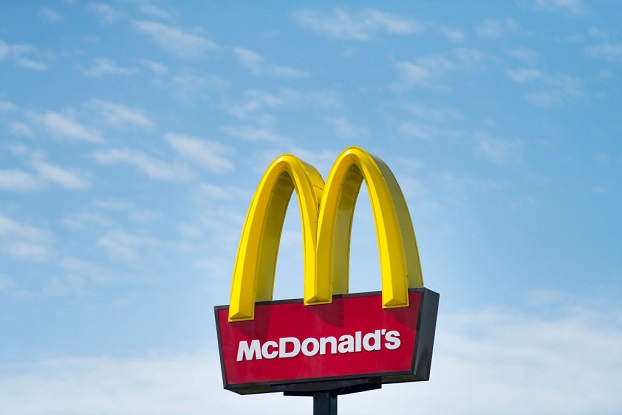 A picture shows the McDonald’s Golden Arches sign against the background of the sky.